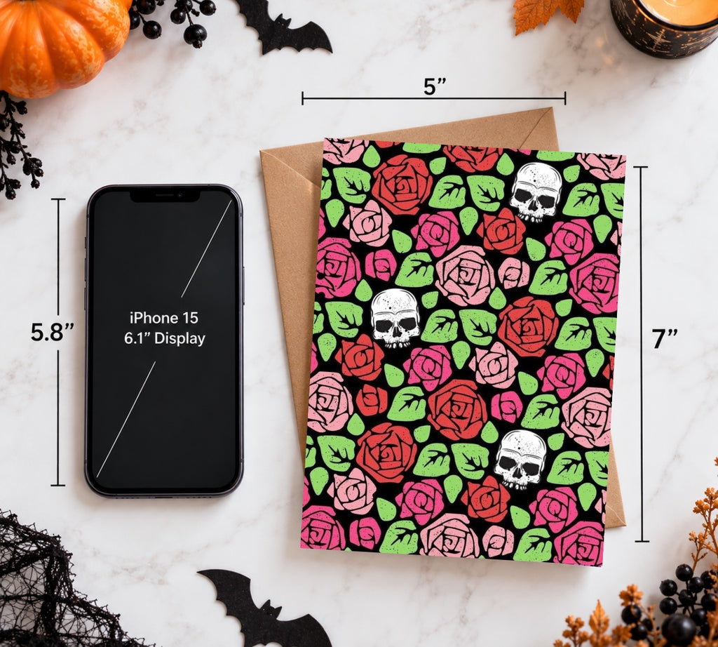 5 by 7 inch skull and roses card beside a phone for scale