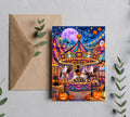 Whimsical Halloween carnival 5x7 greeting card mockup with colorful carousel artwork and kraft envelope